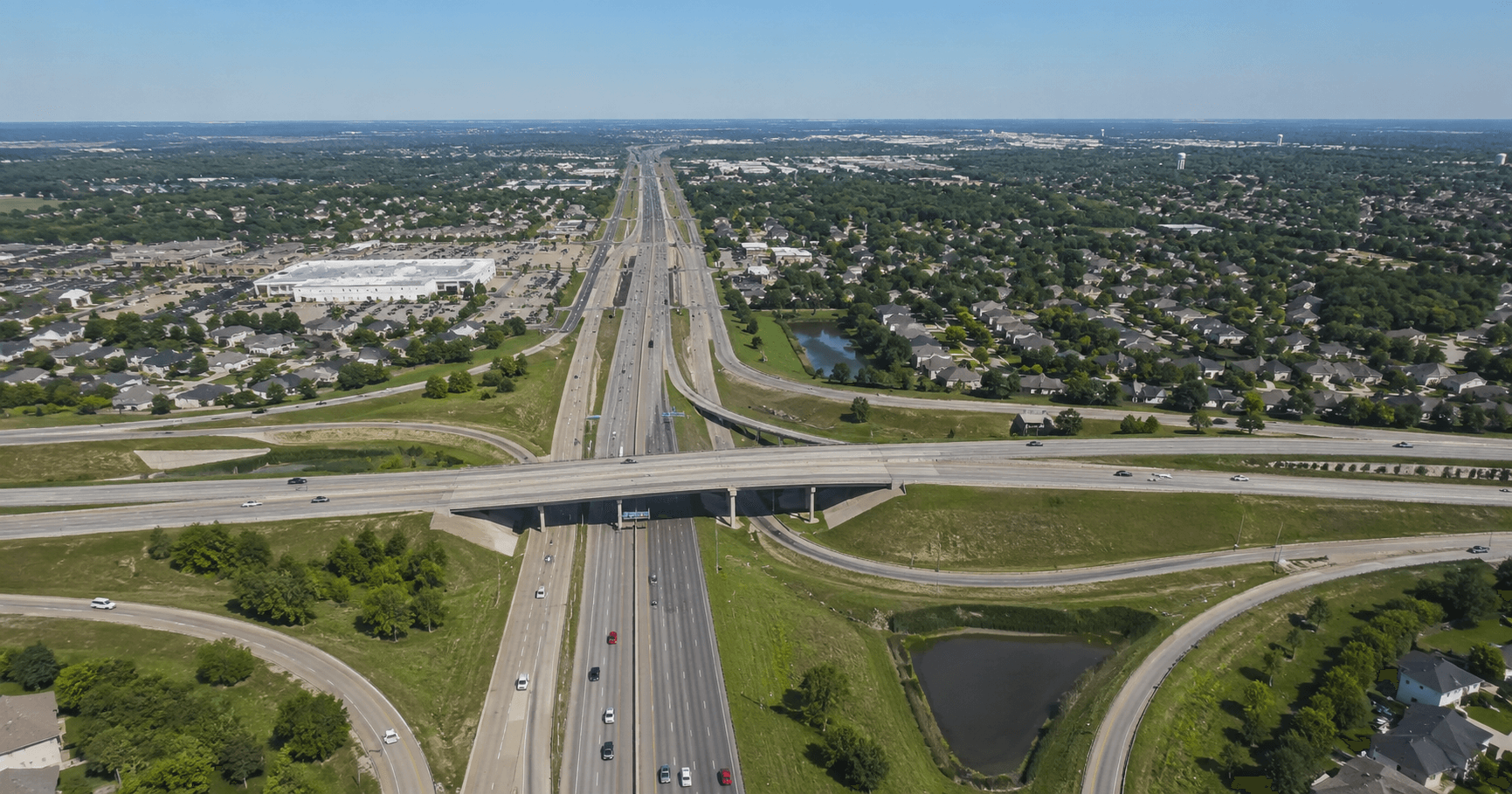 Aerial view of SH 249 highway interchange near North Houston master-planned communities